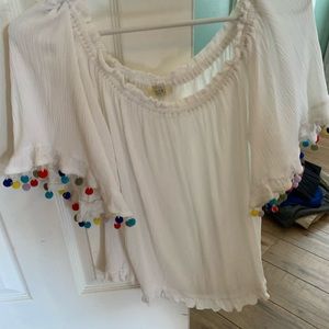 Kori white blouse with puff balls